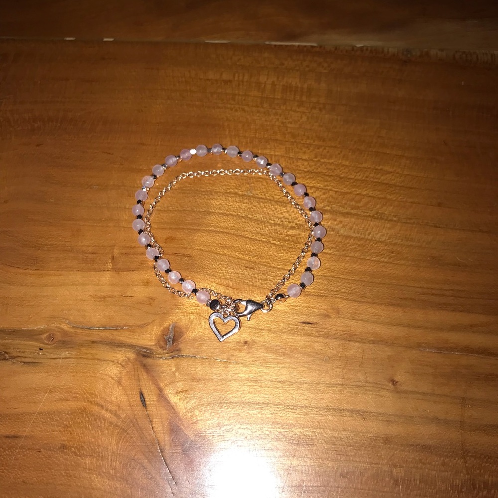 Cute little pink bracelet with a gold heart